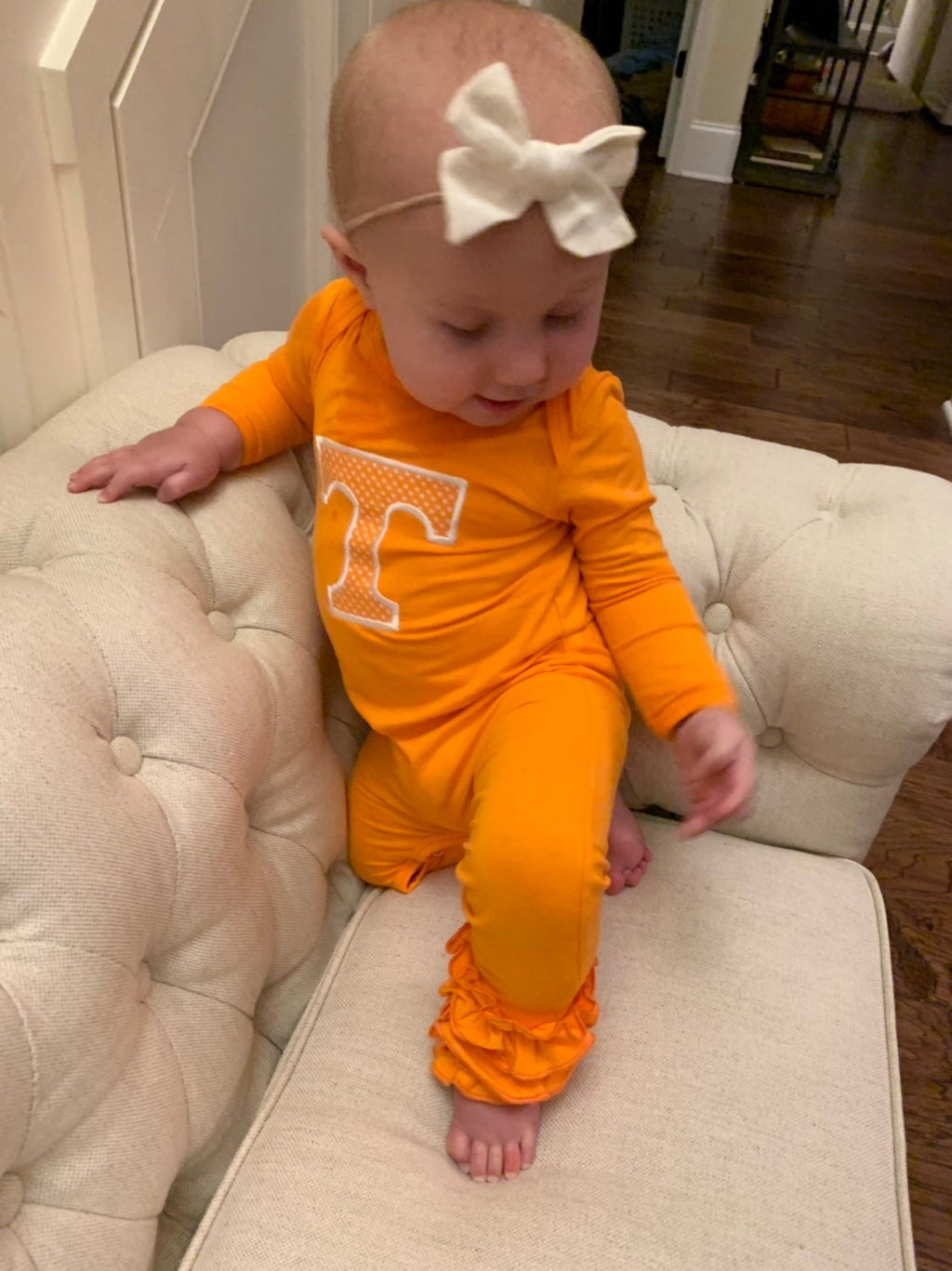 Baby girl in Power T Tennessee outfit